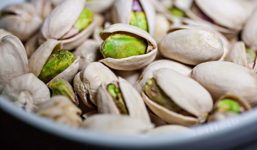 Shelled pistachio. Unshelled pistachio. Pistachio snack.